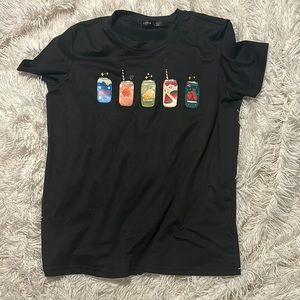 Black tee with sodas on it